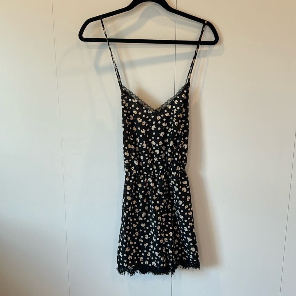 Cross back silk and lace romper. Black with yellow flowers